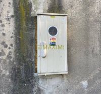 A cabinet on a worn-out wall on Astronomická Street in Bratislava - Ružinov.