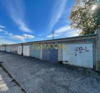 A row of garages on Astronomická Street in Bratislava, Ružinov under the blue sky.