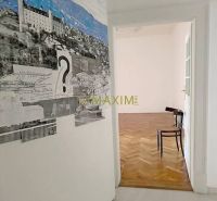 Interior of a 3-room apartment with an artistic wall and a floor with a wooden decor.