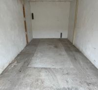 Garages on Dopravná in Piešťany with concrete floors and light-colored walls.