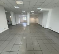 Interior of commercial spaces with white walls and tiles.