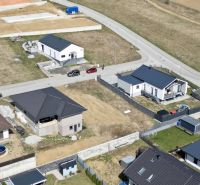 Aerial view of plots - housing in Malý Slavkov with houses under construction.