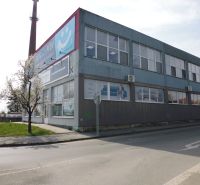 Commercial premises at Masarykova 22 in Prešov, a two-story building by the road.