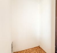 A white space in a 3-room apartment with geometric pattern ceramic tiles.