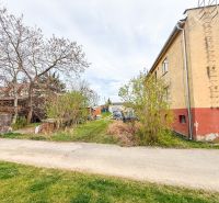 Hrabovská Street in Trenčín, the road runs alongside an older house with a garden.