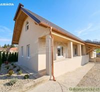 Family house in Dolná Strehová, concrete walkway with decorative gravel, wooden attic.