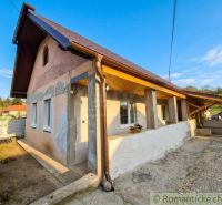 A family house in Dolná Strehová with a metal roof and slanted wooden beams.