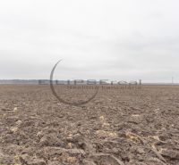 Arable land on agricultural and forest plots, Dolná Street, Zohor, under a cloudy sky.