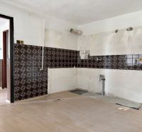 A room with tiles and a wooden decor floor intended for real estate - housing.