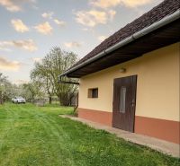 Exterior of a house with a lawn on Biskupická Street in Trenčín, Land - housing.