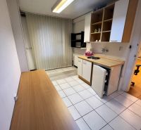 Offices with a kitchenette, tiles, and shelves, suitable for employees.