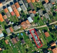 Aerial view of a residential area in Hybe, recreational plots marked with a red outline.
