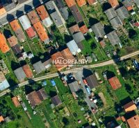 Aerial view of terraced family houses with yards in Hybe.