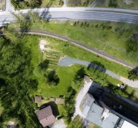 Aerial view of the railway track and surroundings near hotels and guesthouses in the High Tatras.