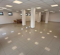 Spacious commercial spaces with white walls, tiles, and columns ideal for various uses.