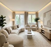 A bright living room with a comfortable sofa set and decorative furniture in a 4-room apartment.