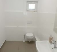 White toilets with a sink and a small window, Warehouses and halls.