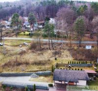 Cottages in Kvakovce surrounded by forest and countryside during autumn.