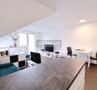 Living space in a 2-room apartment with a wooden decor floor and light decoration.