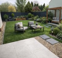 A landscaped garden of a 2-room apartment in Tomášikovo with seating and a pergola.