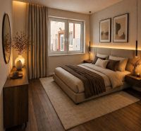 A bedroom in a 2-room apartment with a bed, dresser, and wooden decor flooring.