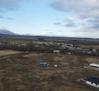 Development plots in Mlynica with panoramic views of snow-capped mountains and open countryside.