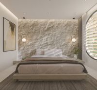 Bedroom in a villa with a textured wall, circular window, and pendant lights.