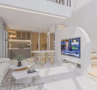 The interior of the villa with a comfortable sofa, television, and a modernly equipped kitchen.