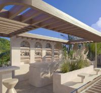 In Nungwi, there is a terrace with a bar in the villa, surrounded by palm trees and greenery.