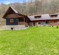 A family house in Horná Mariková with a roof and wooden elements, surrounded by forest.