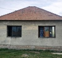 A family house in Nový Život on Malý Máger - Tonkovce Street with a simple facade and a brick roof.