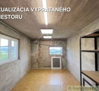 A room with a wood-patterned floor and unfinished walls in a family house.