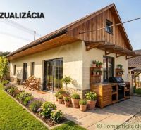 A family house in Stožok with a terrace, grill, and flowers in the garden.