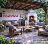 Outdoor terrace of the cottage in Šahy with a fireplace and comfortable seating.