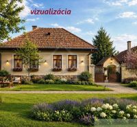 A cottage in Šahy with a flower garden, trees, and traditional architecture.