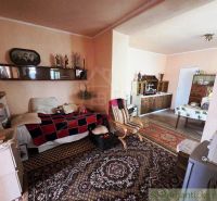 Living room in a family house with furniture and decorations in a classic style.