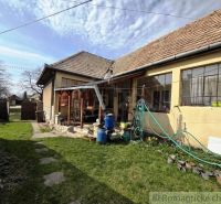A family house in Šahy with a lawn and an extension in the garden.