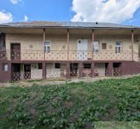 A family house in Zubné with an old facade and a garden in a natural environment.