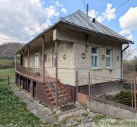 A family house in Zubné with a veranda and stairs in a natural setting.