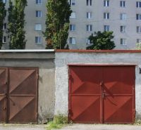 Garages on Varšavská Street in Bratislava - Nové Mesto, residential building in the background.