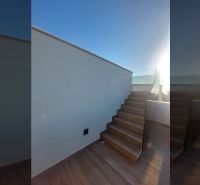 Stairs in the exterior of a recreational apartment with a wood-patterned floor in Privlaka.
