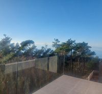 Sea view from the terrace of a Holiday Apartment in Privlaka with elegant glass.