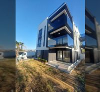 Three-story recreational apartment with a terrace in the town of Privlaka, on Privlaka Street.
