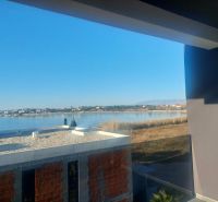 View from the holiday apartment in Privlaka to the peaceful coast of Privlaka street.