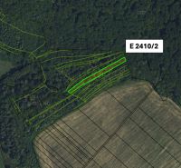 The aerial photograph shows agricultural and forest lands in the area of Veľký Šariš.