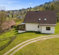A family house in Oravská Lesná surrounded by green countryside on Oravská Lesná street.