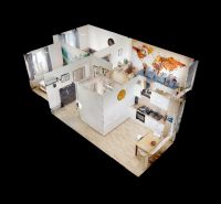 3-room apartment with zones for the kitchen, living area, and bedroom, with a wooden decor floor.