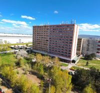 Apartment building in Bratislava, Devínska Nová Ves, Jána Jonáša, surrounded by greenery.