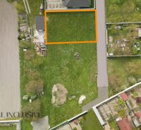 Aerial view of residential plots in Rohovce, green parcels with neighboring buildings.