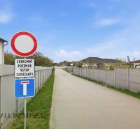 The path between fences in Rohovce, marked with a no-entry sign. Properties - residential.